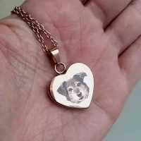 Dog face engraved on stainless steel heart shaped necklace